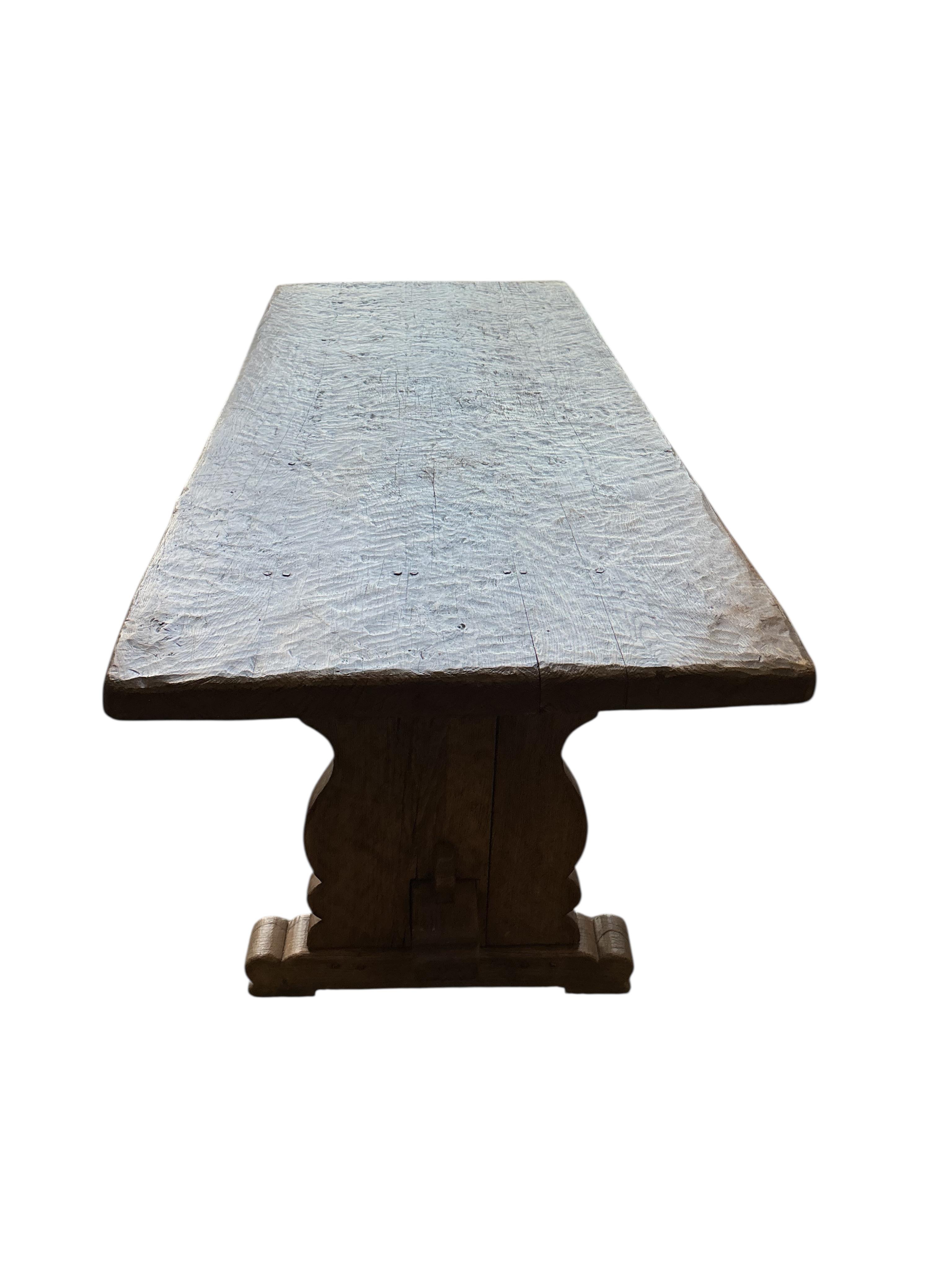 An 18th century style rectangular oak refectory table with adzed single plank top, width 198cm, depth 78cm, height 72cm